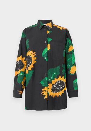 Camicia nera a maniche lunghe con bottoni, decorata con grandi stampe di girasoli gialli e foglie verdi. Tasca singola sul petto, sul lato sinistro.