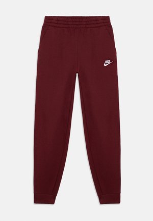 Bordowe spodnie dresowe Nike z elastycznym pasem, kieszeniami po bokach, ściągaczami i białym logo Nike na lewej udzie.