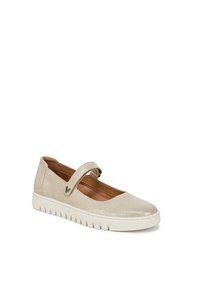 Chaussure Mary Jane beige avec une finition pailletée, bout rond, bride ajustable et une semelle en caoutchouc blanc texturé. Doublure intérieure douce.