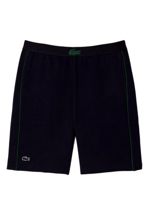 Svarta idrottsshorts med gröna sidsnören, elastisk midja och grönt krokodil-logotyp i mitten samt vit krokodil-logotyp på vänster ben.