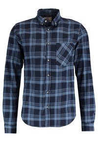 Granatowo-jasnoniebieska kraciasta koszula na guziki z kołnierzem typu spread, długimi rękawami, pojedynczą kieszenią na piersi oraz zaokrąglonym dołem. Materiał bawełniany.