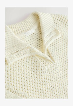 Krēmkrāsas adīta polo krekla ar teksturētu, atvērtu austu rakstu un ribotu apkakli. Uz birkas rakstīts "NEXT," ražots Indijā.