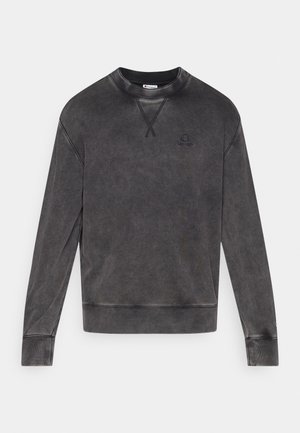 Tumehall puuvillane dressipluus lõdva lõikega, millel on ümmargune kaelus, soonilised varrukasäärtes ning väike logo rinnal.