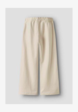 Kremne široke hlače, izdelane iz mehke tkanine. Značilnosti vključujejo elastičen pas in ravne robove. Brez vidnih vzorcev ali kovinskih delov.