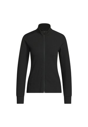 Musta naisten istuva vetoketjullinen takki pystykauluksella, pitkät hihat ja resorikuosi valkoisella taustalla.