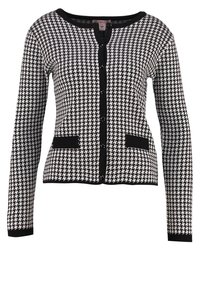 Svartvit hundtandsskarvsmönstrad långärmad cardigan med svart kant, knappstängning och två framfickor.