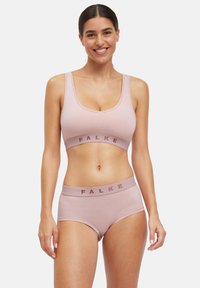 Hellrosa BH- und Slips-Set von FALKE, mit einem schlichten Design, breiten Trägern und einer weichen, glatten Textur mit einem Logo-Band.