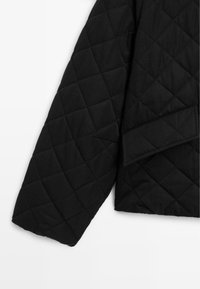 Black quilted jacket with a textured diamond pattern, featuring a folded collar and a smooth, matte finish.