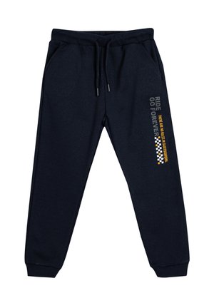 Donkerblauwe sweatpants met een elastische taille en een trekkoord. Voorzien van bedrukte tekst en een geruit patroon langs de zijkant. Zachte stoftextuur.
