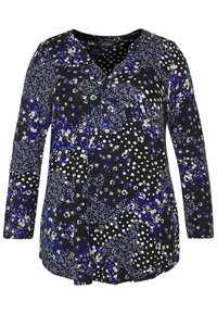 Svart blus med långa ärmar som har ett blommigt och prickigt mönster i blått, vitt och gult. Lättviktig tygkvalitet, knapplåst fram.