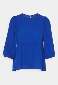 Blusa blu con scollo rotondo e maniche a sbuffo. Realizzata in tessuto testurizzato, presenta un design a strati e una chiusura a occhio di bue sul retro.