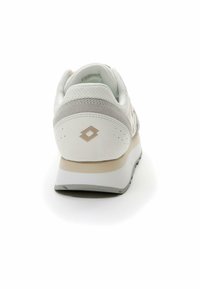 White and light grey athletic sneaker with a textured mesh upper, padded collar, minimal branding on heel, and a contrasting beige midsole.