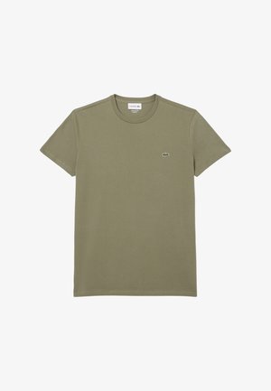 T-shirt in cotone verde con colletto a giro, maniche corte e piccolo logo Lacoste sul lato sinistro del petto. Tessuto morbido, design informale.