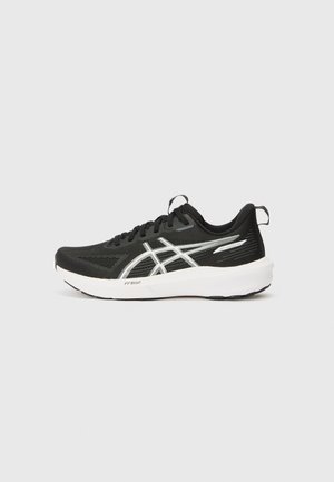 Black athletic shoe with mesh upper, white sole, reflective accents, and textured pattern on sides. Features laces and heel tab for support.