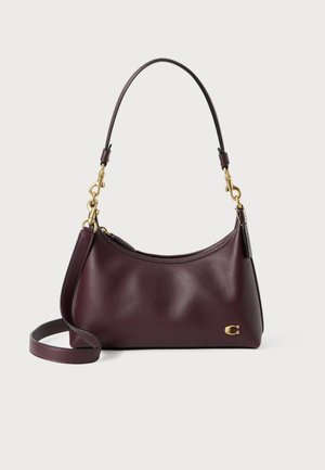 Dark burgundy leather shoulder bag with gold-tone hardware, a short handle, detachable long strap, and a gold "C" logo on the bottom right.