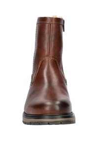 Bruin leren enkelboot met een geribbelde afwerking, zijrits en gestikte accenten. Bevat een gladde neuskap en een rubberen zool.