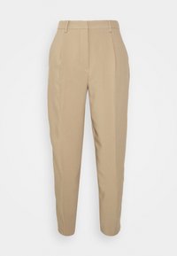 Pantalon beige taille haute, coupe ajustée, avec passants pour ceinture, poches latérales et jambes fuselées et étroites.
