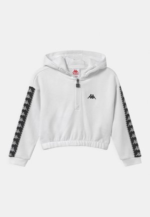 Sweatshirt blanc court avec capuche, présentant un zip demi-longueur, une taille élastique et des panneaux latéraux noirs avec un motif de logo répété.