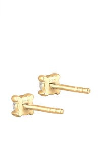 Guldbelagte 925 sterling sølv blomstformede stud øreringe med en glat overflade og en central cubic zirconia accent.
