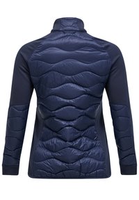 Navy padded jacket with a high collar. Features a quilted texture on the back and smooth fabric on the arms and sides.