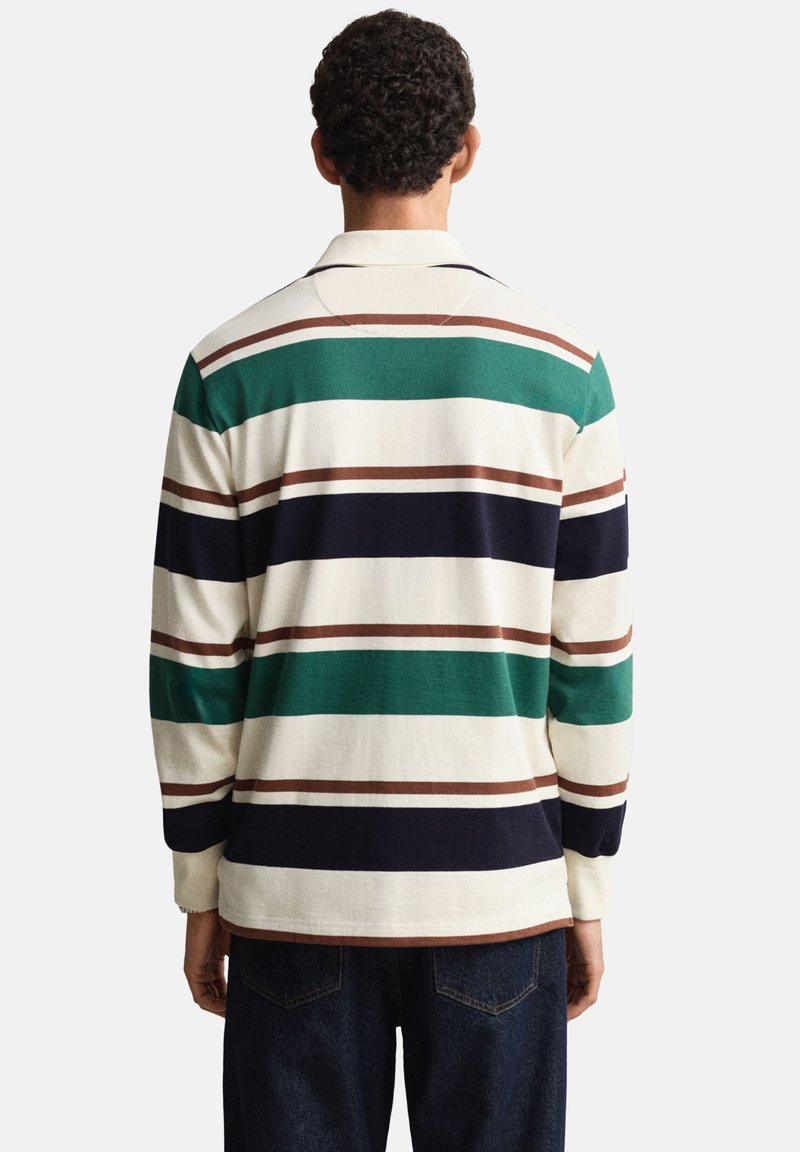 Long-sleeve polo shirt in cream with green, brown, and navy horizontal stripes. Soft cotton material with a classic collar and relaxed fit.