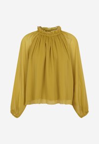 Blusa a maniche lunghe di colore giallo senape con scollatura arricciata e polsini elastici. Realizzata in tessuto leggero e trasparente con un design fluido.