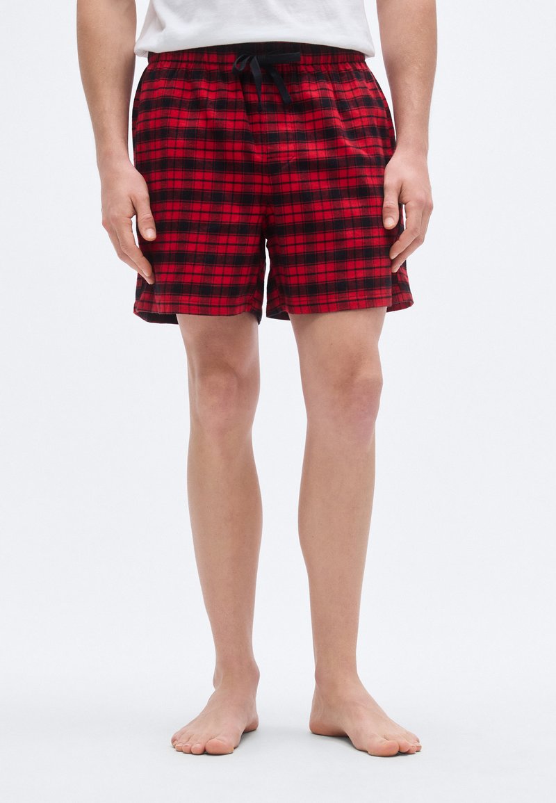 Κόκκινο και μαύρο καρό σορτς με ελαστική μέση και κορδόνι ρύθμισης. Μαλακό ύφασμα με άνετη εφαρμογή, σχεδιασμένο για άνεση και ευκολία κινήσεων.