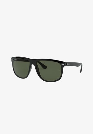 Gafas de sol de plástico negro con lentes verdes. Diseño de marco angular, con un logotipo prominente en la patilla y un acabado liso y brillante.