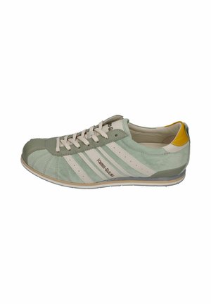 Light green suede sneaker with white stripes, beige laces, a yellow heel patch, and a low-profile sole.