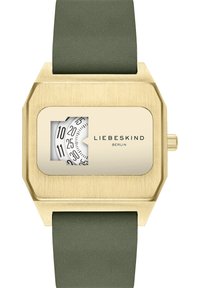 Montre en métal doré avec un boîtier octagonal, un bracelet en caoutchouc vert et un cadran rectangulaire affichant des index horaires noirs et le nom de la marque.