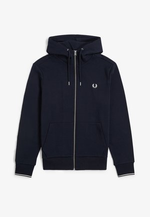 Felpa con cappuccio blu navy con zip, cappuccio con coulisse, polsini a coste con bordo bianco, tasche frontali e piccolo logo ricamato bianco sul petto.