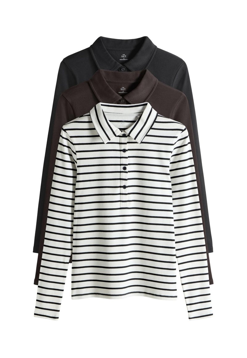 Set of three long-sleeve polo shirts: one striped white with black, one solid dark brown, and one solid black; soft fabric, classic collar design.