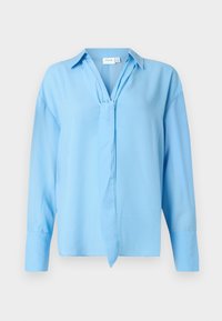 Γαλάζια, μακριά μπλούζα με γιακά και λεπτομέρεια με κόμπο μπροστά, φτιαγμένη από απαλό ύφασμα, παρουσιασμένη σε λευκό φόντο.