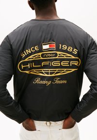 Tommy Hilfiger F1 MOVIE LINER JACKET - Jachetă subțire - primary red