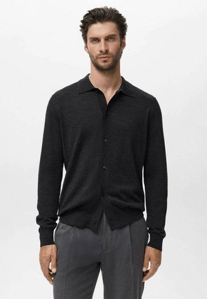 Black button-up cardigan in soft fabric, with a collared neckline, long sleeves, and a straight hemline. Features front button closure.