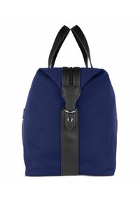 Marineblaue Canvas-Tasche mit einem schwarzen Ledergriff und Beschlägen. Verfügt über einen oberen Verschluss und zwei schwarze Griffe zum Tragen.