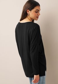 Next Pitkähihainen paita - black