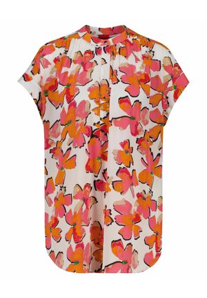 Blouse à manches courtes avec col montant, plis devant et motif floral vif rose, orange et beige sur fond blanc.