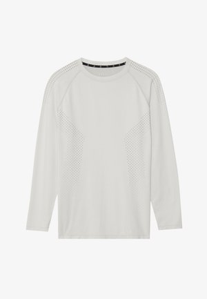 Maglietta a maniche lunghe grigia chiaro con maniche raglan, caratterizzata da accenti perforati sui lati e un colletto a girocollo. Tessuto morbido e liscio.