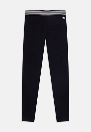 Schwarze Leggings mit einem gestreiften elastischen Bund, die eine glatte Textur und eine enganliegende Silhouette aufweisen, geeignet für sportliche oder lässige Outfits.
