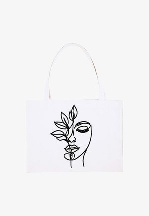 Witte totebag met zwarte lijntekening van een vrouwenhoofd gedeeltelijk bedekt door een tak met bladeren.