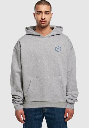 Gray hoodie with a front pocket, relaxed fit, featuring a blue flower embroidery on the left chest and ribbed cuffs at the sleeves.