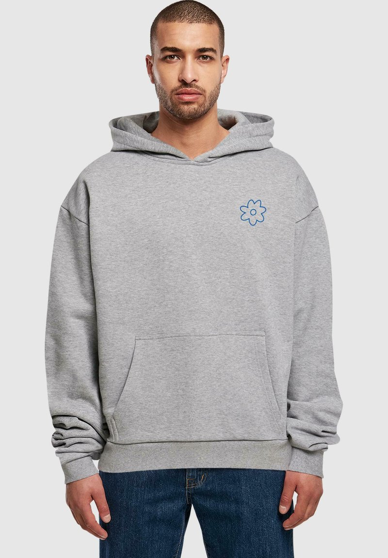 Gray hoodie with a front pocket, relaxed fit, featuring a blue flower embroidery on the left chest and ribbed cuffs at the sleeves.