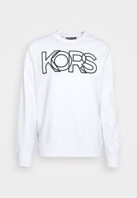 Sudadera blanca con el logo "KORS" en contorno negro. Presenta cuello redondo y mangas largas, fabricada en un tejido suave y ligero.
