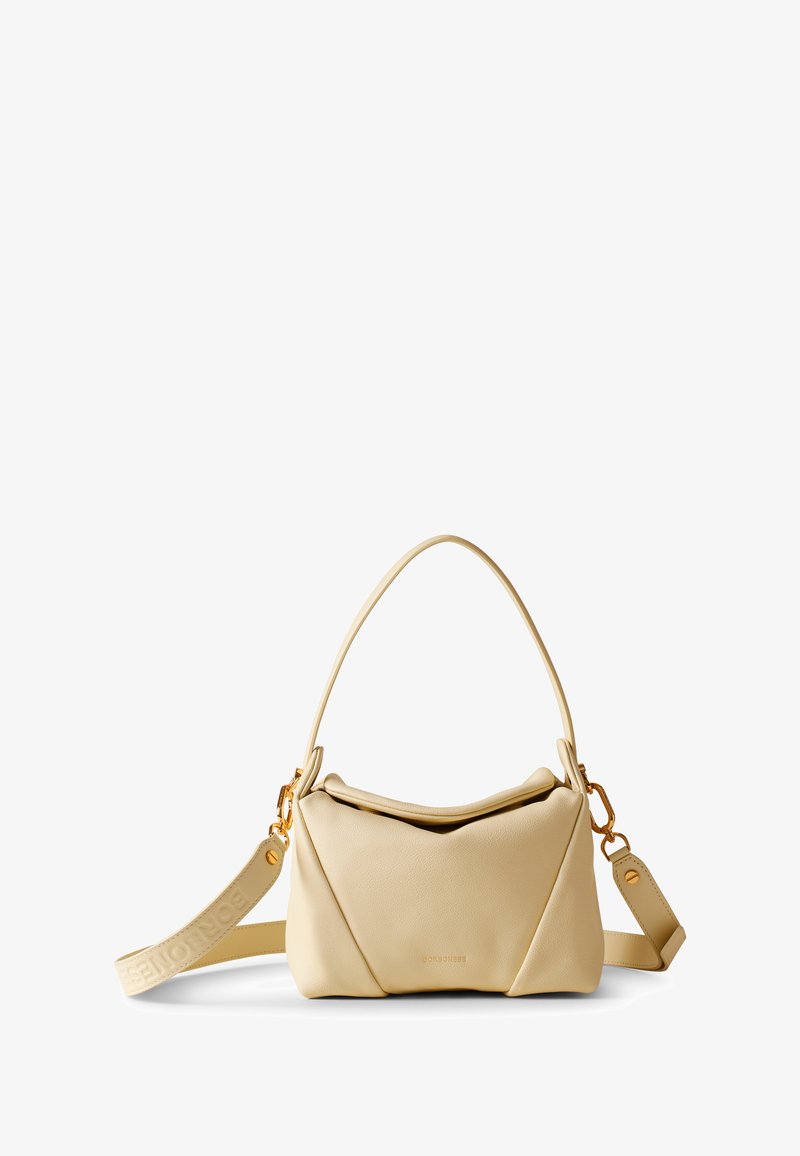 Beige leather handbag with a structured design, curved top, and gold hardware. Includes a detachable strap featuring a logo.