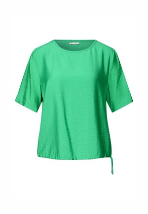 Krátký rukáv top v jasně zelené barvě, vyrobený z hladkého materiálu s jemným leskem. Má kulatý výstřih a detaily s vázáním na boku.