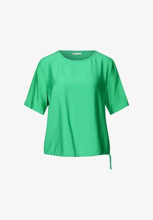 Krótki rękaw w intensywnym zielonym kolorze, wykonany z gładkiego materiału o delikatnym połysku. Posiada okrągły dekolt oraz detale w postaci kokardy z boku.