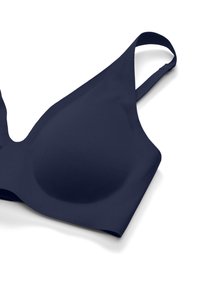 Reggiseno blu navy senza cuciture con coppe sagomate e spalline regolabili, progettato per un supporto morbido e confortevole.