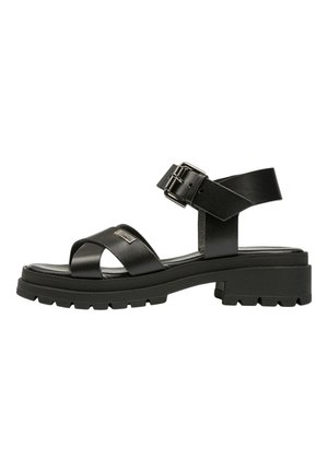 Black leather sandals with a chunky sole, featuring cross straps and an adjustable ankle buckle, textured finish, and flat heel.