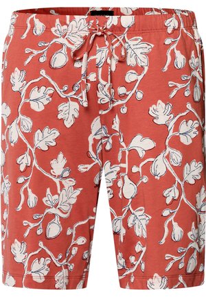 Červené kraťasy vyrobené z bavlny s elastickým pasem na šňůrku, zdobené bílým botanickým vzorem s listy a poupaty na látce.